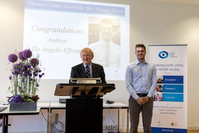 Thomas Cottier presents the Best Thesis Award to Andrea De Angelis Effrem    
